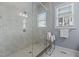 Bright glass shower with a bench and a window for lots of natural light at 1508 Heritage Reserve Ct, Wake Forest, NC 27587
