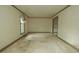 Spacious bedroom with ample natural light and neutral carpeting, ready for customization at 1513 Western Ave, Rocky Mount, NC 27804