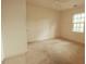 Bright bedroom with a large window, showcasing a serene space for relaxation and rest at 1513 Western Ave, Rocky Mount, NC 27804