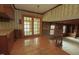 Inviting dining room featuring wood floors, french doors and large windows perfect for Gathering gatherings at 1513 Western Ave, Rocky Mount, NC 27804