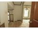 Hallway with staircase and neutral carpet, ready for new personal touches at 1513 Western Ave, Rocky Mount, NC 27804