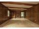 Inviting living room featuring wood paneling and a cozy fireplace, perfect for Gathering gatherings at 1513 Western Ave, Rocky Mount, NC 27804