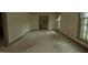 Open-concept living room with natural light, showcasing the room's layout and connection to other areas at 1513 Western Ave, Rocky Mount, NC 27804
