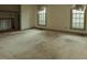 Spacious living room with two windows offering ample natural light and a glimpse of the home's architecture at 1513 Western Ave, Rocky Mount, NC 27804