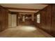 Inviting living room featuring wood paneling with a view of the entry, perfect for Gathering gatherings at 1513 Western Ave, Rocky Mount, NC 27804