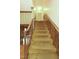 Traditional staircase with carpet runner and wood railing, offering a classic touch to the home at 1513 Western Ave, Rocky Mount, NC 27804
