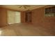 Bright sunroom with brick accent wall and sliding doors, perfect for relaxation and entertaining at 1513 Western Ave, Rocky Mount, NC 27804