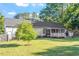 Spacious backyard features a screened porch and a manicured lawn at 1819 Umstead Rd, Durham, NC 27712