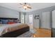 Bedroom featuring wood floors, soft blue walls and lots of natural light at 1819 Umstead Rd, Durham, NC 27712