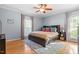 Comfortable bedroom with wood floors, neutral walls and a ceiling fan at 1819 Umstead Rd, Durham, NC 27712