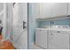 Laundry area with washer and dryer near sliding barn door at 1819 Umstead Rd, Durham, NC 27712
