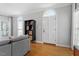 Bright living room with large arched windows, hardwood floors, and neutral decor providing a versatile and inviting space at 1819 Umstead Rd, Durham, NC 27712