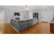 Cozy living room with hardwood floors, a fireplace, and a large sectional sofa creating a comfortable space for relaxation and entertainment at 1819 Umstead Rd, Durham, NC 27712