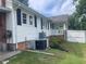 Exterior home view with air conditioning units and well maintained siding at 2037 Swepsonville Rd, Graham, NC 27253