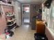Functional laundry room with washer, dryer, storage shelves, and access to the kitchen at 2037 Swepsonville Rd, Graham, NC 27253