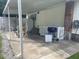 Covered patio with a grill, refrigerator, dining area, and utility hookups at 2037 Swepsonville Rd, Graham, NC 27253