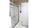 Bathroom features tiled shower and tub combo with glass doors at 2071 Meadow Ln, Graham, NC 27253