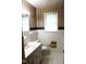 Bathroom featuring tile floor, white cabinets, and good light at 2071 Meadow Ln, Graham, NC 27253