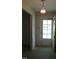 Entryway with a vintage light fixture and glass-paneled door that brings in natural light at 2071 Meadow Ln, Graham, NC 27253