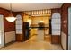 Kitchen and dining area featuring wood accents, neutral cabinets, black appliances and an open layout at 2071 Meadow Ln, Graham, NC 27253