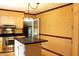 Cozy kitchen features stainless steel appliances, granite countertops and a center island at 2071 Meadow Ln, Graham, NC 27253