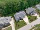 Aerial view of home with lush landscaping and mature trees at 2121 Vecchio Ln, Apex, NC 27502