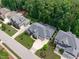Aerial view showcasing home, landscaping, and surrounding neighborhood at 2121 Vecchio Ln, Apex, NC 27502