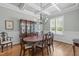 Formal dining room with coffered ceiling and classic wood furniture at 2121 Vecchio Ln, Apex, NC 27502