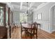Well-lit dining room showcasing hardwood floors and a classic china cabinet at 2121 Vecchio Ln, Apex, NC 27502
