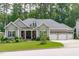 Charming single-Gathering home features a landscaped front yard and three-car garage at 2121 Vecchio Ln, Apex, NC 27502