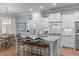 Well-appointed kitchen with large island, stainless steel appliances, and breakfast bar seating at 2121 Vecchio Ln, Apex, NC 27502