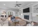 Inviting living room offers a fireplace, built-in shelving, and views of the home's entryway at 2121 Vecchio Ln, Apex, NC 27502