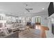 Open-concept living room and kitchen with hardwood floors and recessed lighting throughout at 2121 Vecchio Ln, Apex, NC 27502