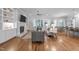 Open-concept living room with a cozy fireplace and built-in bookshelves at 2121 Vecchio Ln, Apex, NC 27502