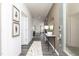Inviting entryway with gray flooring, console table and decorative mirror at 218 Macon Lake Drive # 43, Apex, NC 27523