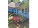 Back of house featuring a wooden deck with flowers and foliage at 2237 Keith Hills Rd, Lillington, NC 27546