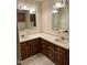 Bathroom featuring double vanities, mirrored cabinets, and tile flooring at 2237 Keith Hills Rd, Lillington, NC 27546