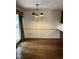 Classic dining room featuring hardwood floors and an elegant chandelier at 2237 Keith Hills Rd, Lillington, NC 27546