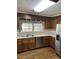 Functional kitchen with stainless steel appliances and oak cabinets at 2237 Keith Hills Rd, Lillington, NC 27546