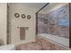 Modern bathroom with tiled shower, glass door, and wainscoting paneling at 2283 Mays Chapel Rd, Sanford, NC 27330