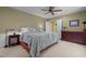 Well-lit bedroom featuring neutral walls, soft carpet, and adjacent to a walk-in closet at 2283 Mays Chapel Rd, Sanford, NC 27330