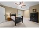 Cozy bedroom featuring a ceiling fan and a black bed frame with a beige blanket at 2283 Mays Chapel Rd, Sanford, NC 27330