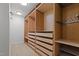 Spacious walk-in closet featuring custom built-in shelving and storage drawers at 2283 Mays Chapel Rd, Sanford, NC 27330
