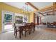 Elegant dining room with stylish lighting, a view to the backyard, and open access to the living area at 2283 Mays Chapel Rd, Sanford, NC 27330