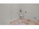 Functional laundry room with utility sink, tiled floors, and white painted door at 2283 Mays Chapel Rd, Sanford, NC 27330
