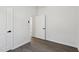 Empty bedroom with wood-look flooring and white walls at 2301 Pinecroft Dr, Burlington, NC 27217