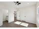 A bright bedroom featuring modern lighting, access to the bathroom and closet space at 2301 Pinecroft Dr, Burlington, NC 27217