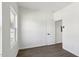 Neutral bedroom with light walls, wood-look floor, and a bright window at 2301 Pinecroft Dr, Burlington, NC 27217