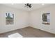Spacious bedroom with natural light, wood-look floors and a ceiling fan at 2301 Pinecroft Dr, Burlington, NC 27217