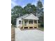 Charming single-story home with a welcoming front porch and a newly paved driveway at 2301 Pinecroft Dr, Burlington, NC 27217